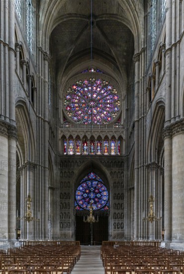 Reims, France- 13 September, 2022: view of the reverse side of the West Facade of the Reims Cathedral with colorful stained glass windows and sculptures