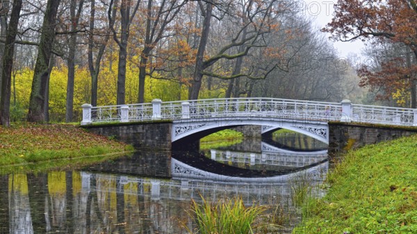 Autumn landscape in Catherine Park, Pushkin, Russia, view of the river and the bridge, Europe
