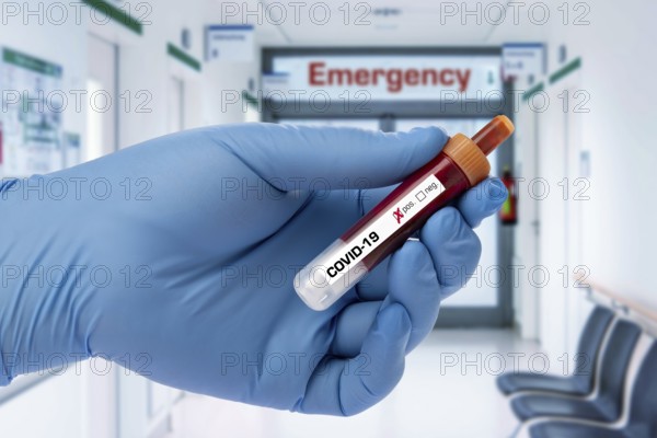 Covid 19 person holding a test tube with coronavirus, in the lab