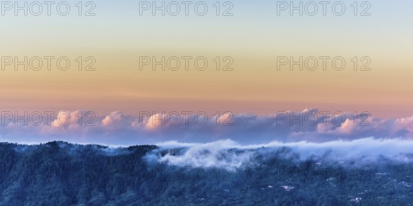 Amazing panorama view on clouds above mountain from summit of Batur volcano, Bali, Indonesia, Asia