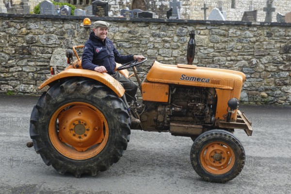 Old tractor Someca in front of church and chapel Sainte Nonne, vintage car meeting Dirinon, department Finistere Penn ar Bed, region Bretagne Breizh, France, Europe