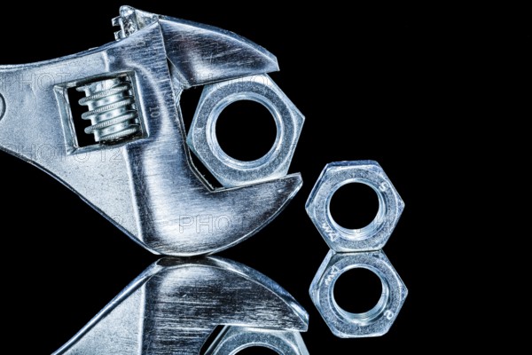 Construction nuts adjustable spanners on black background