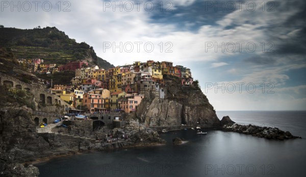 Picturesque and romantic village of Manarola with colourful houses and small beautiful port at CinqueTerre, Liguria, Italy, Europe