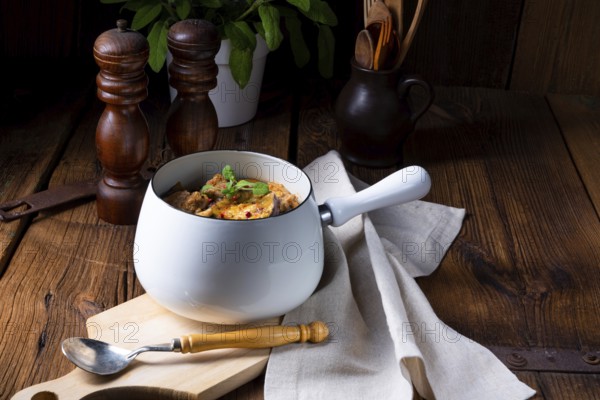 Veal goulash with baked aubergine and herbs
