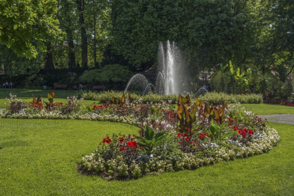 Blooming garden with impressive flower beds and bubbling fountain, meersburg, bodensee, germany