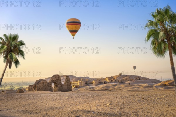 Hot air balloon over ruins of Hatshepsut temple in Luxor, Egypt, Africa