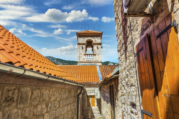 Belltower in the Old Town of Kotor at sunny day