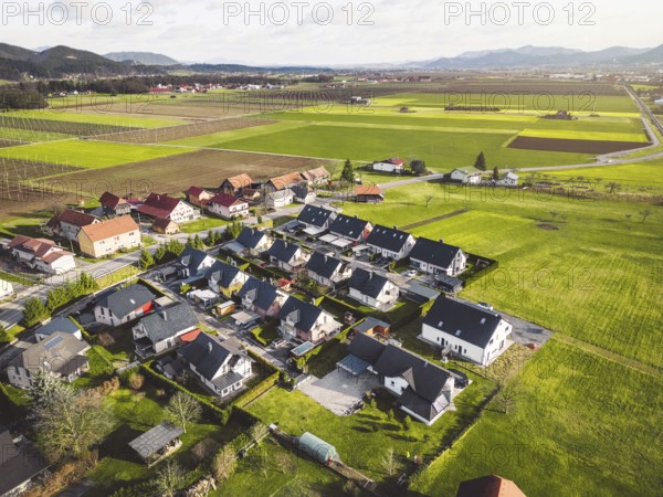 Drone view, aerial shoot of new build houses in the suburbs of Slovenia, somewhere in the country side, Europe. New modern houses, family homes