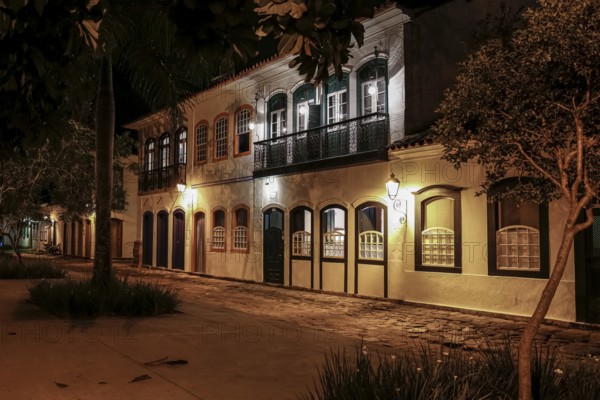 Atmospheric night view of illuminated street and buildings in historical center of Paraty, Brazil, Unesco World Heritage, South America
