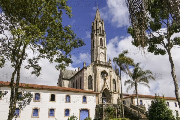 View to church and buildings with blue sky and white clouds, Sanctuary Caraça, Minas Gerais, Brazil, South America