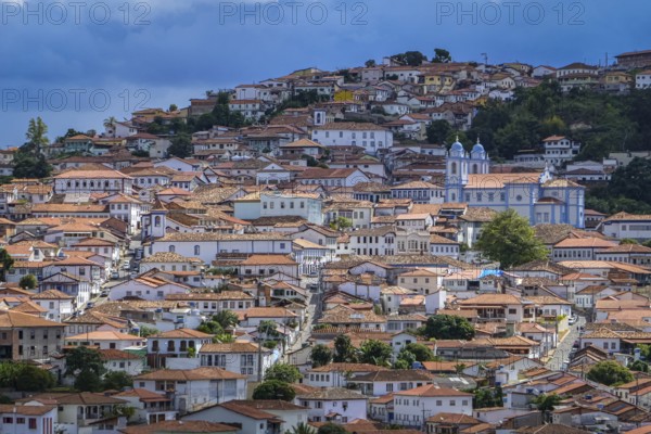 Close-up aerial view with sunshine, shadow and clouds to the historic town center of Diamantina, Minas Gerais, Brazil, South America