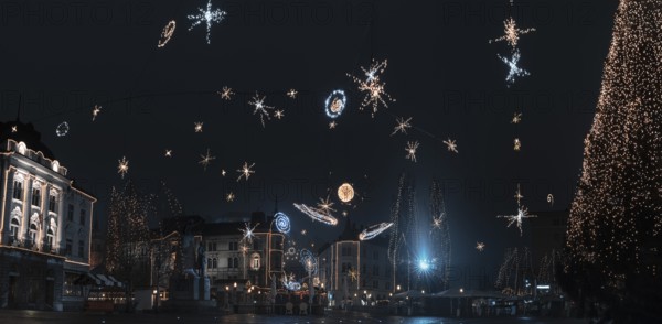 Panorama with the city center of Ljubljana, capital of Slovenia, decorated with Christmas lights, on a cold night of December