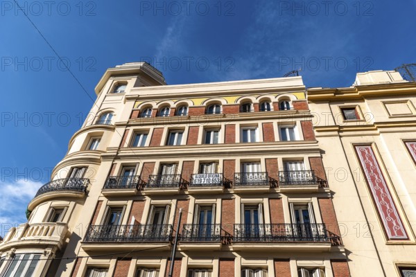 Madrid, Spain, November 1, 2020: Old residential building with iron balconies in the downtown of Madrid. Low angle view against sky, Europe