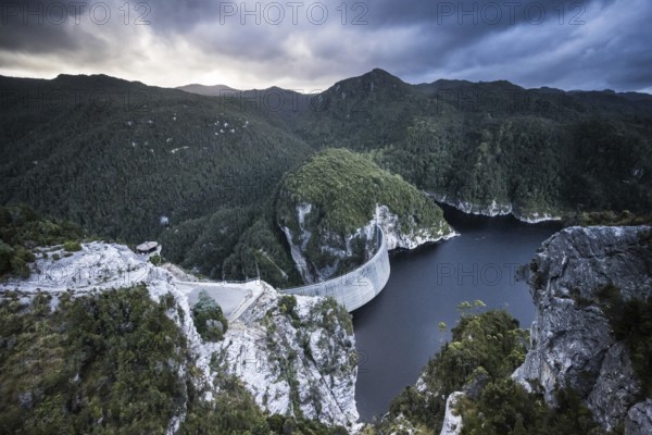 View of the Gordon Dam on a cool summer's day. It is a unique double curvature concrete arch dam with a spillway across the Gordon River near Strathgordon, South West Tasmania, Australia, Oceania