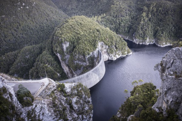 View of the Gordon Dam on a cool summer's day. It is a unique double curvature concrete arch dam with a spillway across the Gordon River near Strathgordon, South West Tasmania, Australia, Oceania