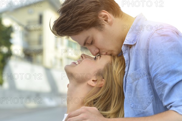 Beautiful couple in love dating outdoors and smiling