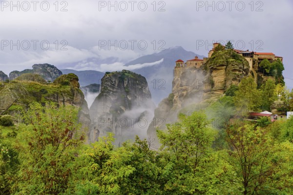 Monastery of Varlaam in the fog, the second largest Eastern Orthodox monastery in Meteora, Greece, Europe
