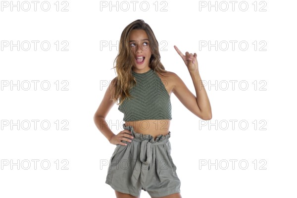 Brunette teenager girl portrait funny gesture on white background