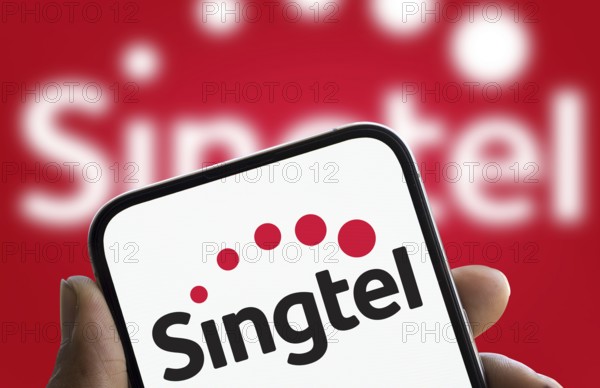 Singtel logo is displayed on smartphone. Singtel, is a Singaporean telecommunications conglomerate
