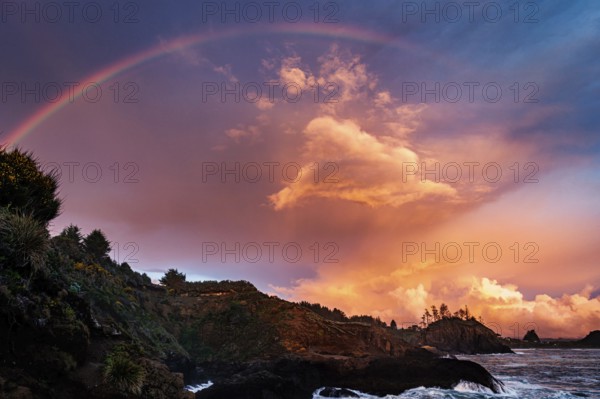 A Rainbow over a beautiful sunset at the beach, Northern California, USA, North America