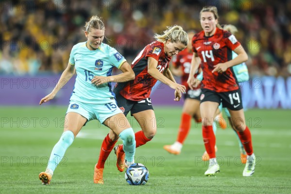 MELBOURNE, AUSTRALIA, JULY 31: Clare HUNT of Australia and Cloe LACASSE of Canada tackle as Australia plays Canada at the FIFA Women's World Cup Australia New Zealand 2023 at Melbourne Rectangular Stadium on July 31, 2023