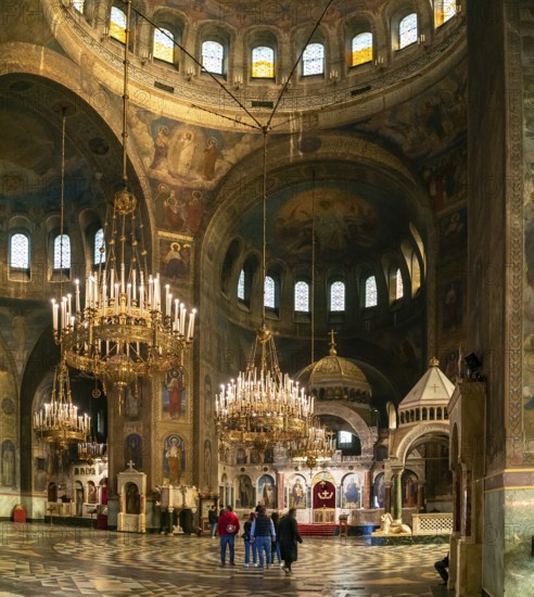 Sofia, Bulgaria, 30 October, 2022: interior view of the main hall of the Alexander Nevsky Cathedral with ornate chandeliers, Europe