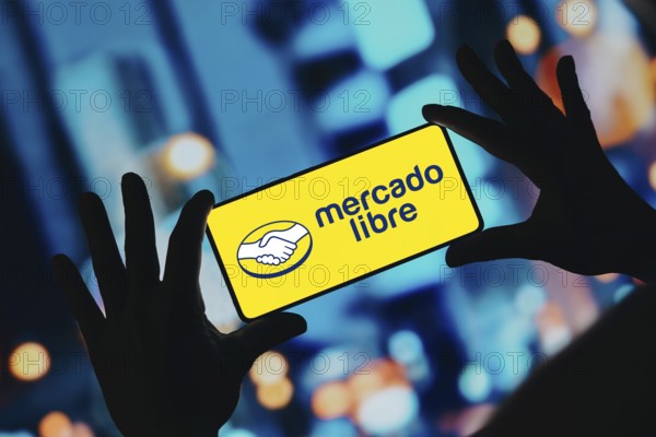 In this photo illustration, the Mercado Libre logo is displayed on a smartphone screen