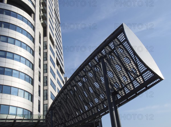 Leeds, west yorkshire, united kingdom, 16 july 2019: close up of bridgewater tower in whitehall place leeds west yorkshire and wind deflectors put in place to manage turbulence on the road