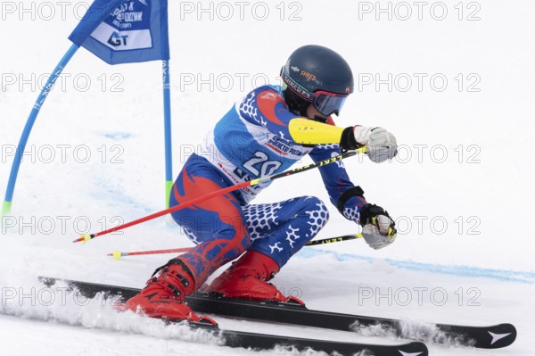 KAMCHATKA PENINSULA, RUSSIAN FAR EAST, APRIL 2, 2019: Russian Men's Alpine Skiing Championship, giant slalom. Mountain skier Prikhodchenko Vadim Moscow skiing down snowy mountain slope
