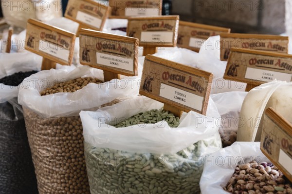 Cangas de Onis, Spain, March 31, 2019: Assortment of beans and other legumes in sacks in food market, Europe
