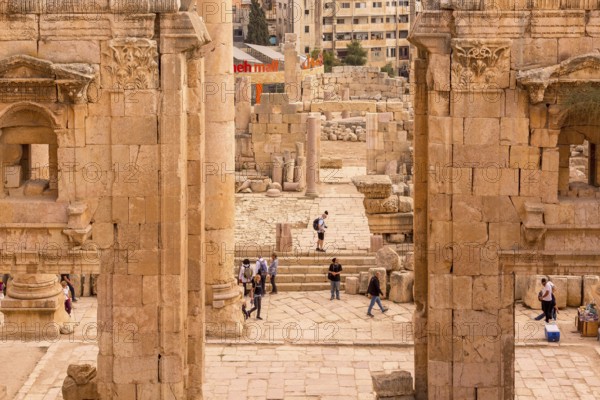 Jerash, Jordan, November 7, 2022: People visiting Gerasa ancient roman city, archs and ancient ruins, Asia