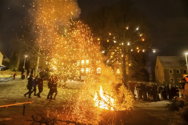 Christmas tree burning on the Kleinnauendorf fairground. The local history association G-Haus invited people to a fiery spectacle to part with their old Christmas trees. What was particularly remarkable was the fact that there were very quickly burning specimens and, in turn, almost unburnable ones, Kleinnauendorf, Saxony, Germany, Europe