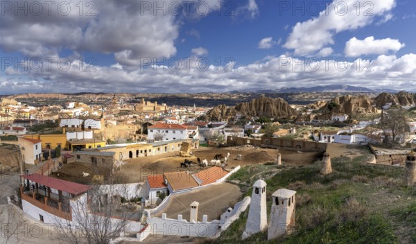Guadix, Spain, 24 February, 2024: panorama view of the troglodyte houses in the Barrio de Santiago of Guadix, Europe