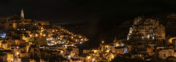 Famous cave church Saint Mary of Idris and the cathedral of Matera at night, Italy, Europe