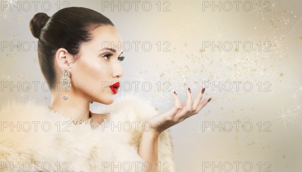 Upscale woman wearing gold jewellery and red lipstick on light background, Toronto, Canada, North America