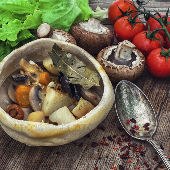 Vegetable hot plate made of baked dough cooked in a rustic style.Photo tinted