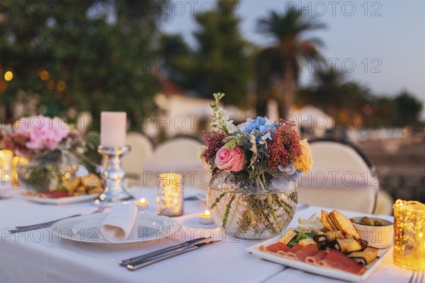 Flower compositions on the wedding table in rustic style. Wedding decorations with their own hands. Wedding in Montenegro