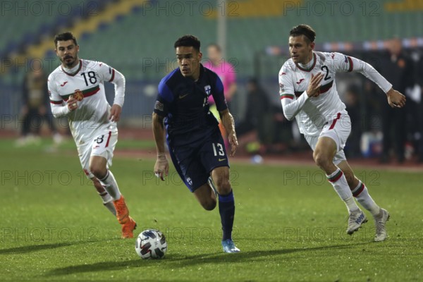 Sofia, Bulgaria - 15 November, 2020: Bulgaria's Galin Ivanov (L) and Strahil Popov (R) in action with Finland's Pyry Soiri (C) during the UEFA Nations League group stage, League B, Group 4 match between Bulgaria and Finland, Sofia, Bulgaria, Europe