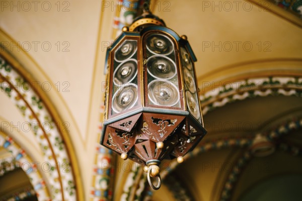 Antique German lamp on the ceiling. Octagon with Fresnel lenses.