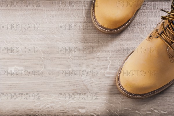 Copyspace image two working boots on wood board