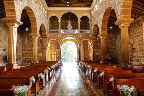 Interior colonial Cathedral of the Immaculate Conception, light is falling through door, Barichara, Colombia, South America