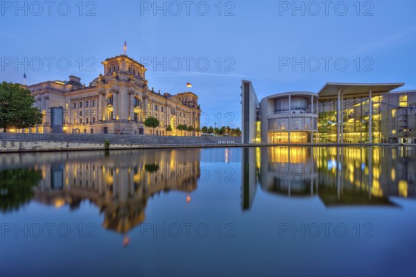 The Reichstag and the Paul Löbe House on the Spree in Berlin at dusk