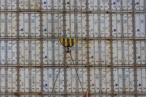 Stack of freight containers in the harbour, arranged in even rows, hook in the middle, Bremerhaven, Bremen, Germany, Europe
