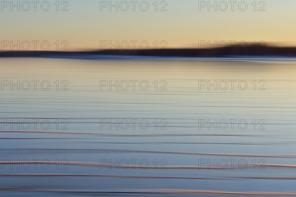 Abstract of sea covered with frozen ice at sunset in winter using ICM (Intentional camera movevement) technique, Kallahdenniemi, Helsinki, Finland, Europe