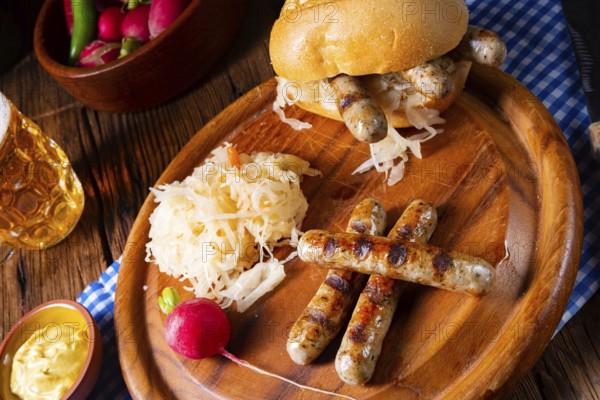 Rustic Thuringian bratwurst with sauerkraut and roll