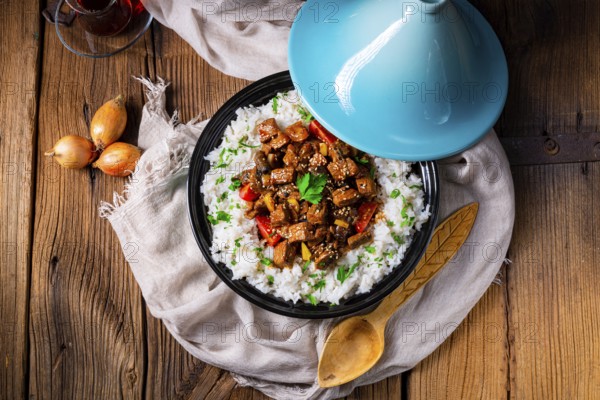 Tajin beef stew with rice, peppers and sesame seeds
