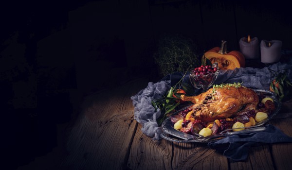 Roast duck with potato dumplings and plums