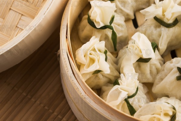 Chinese dumplings in bamboo steamers