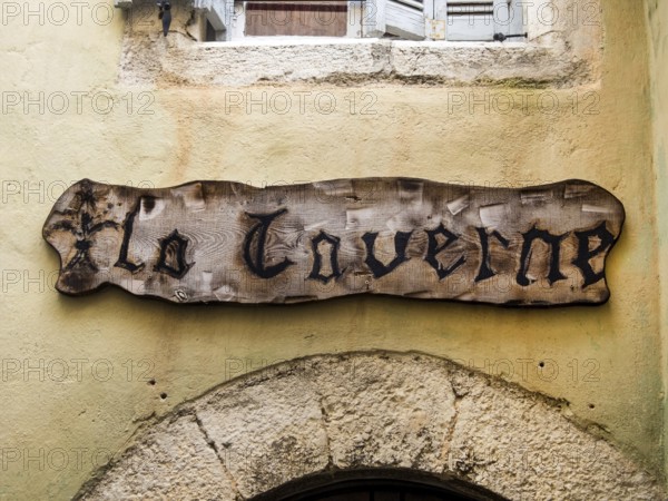 A wooden sign on a house wall in France Austria