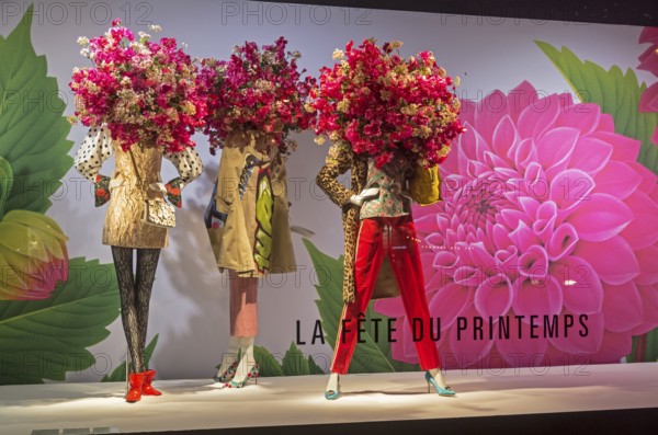 PARIS, FRANCE, MARCH 27, 2017: Mannequins in the showcase of the Printemps department store in Paris, France. Spring and summer theme